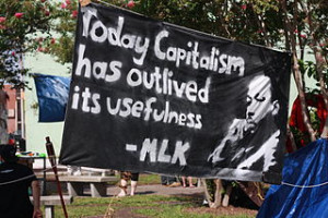 Sign with MLK Jr quote:" Capitalism has outlived its usefulness"