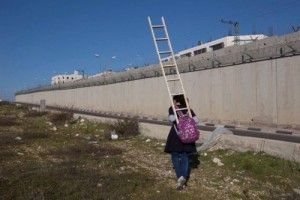 Ladder needed to cross the Occupation wall on the way to school A schoolgirl, a ladder, a wall