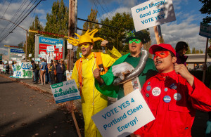 Portland Clean Energy Initiative sign waving @walmart