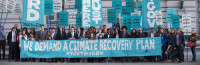 photo of people with banners: "we demand a climate plan"